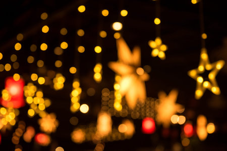 Colorful night lights blurred abstract bokeh farewell party lights from colorful light bulb in pub...