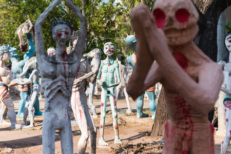 Suphan Buri, Thailand - October 23, 2019: craft monuments of Many ghost men and women simulated hell to punish bad people in Buddhist religion at Wat Phai Rong Wua. Famous travel destination.のeditorial素材