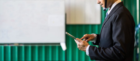 Closeup smile Factory manager check inventory stock by corporate application on tablet in warehouse....