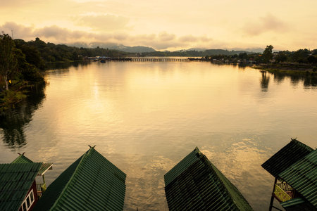 Home stay resort by riverbank at sunrise in Sangkhlaburi, Kanchanaburi, Thailand. Famous travel...