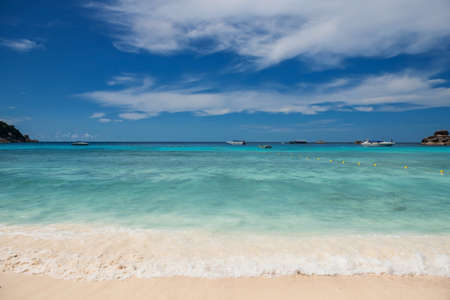 Motion wave at beach with turquoise andaman sea of Similan island, Phang Nga, Thailand.. Travel destination or summer holiday vacation in tropical country, Siam. Seacape background.の写真素材