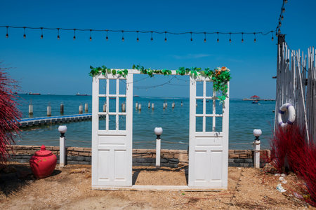 White door decoration by the sea for traveller to take portrait photo. Exterrior designの写真素材