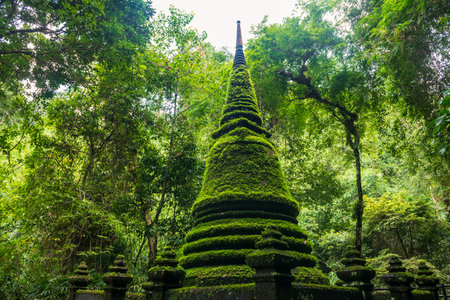 Ancient pagoda attached by moss at Phlio waterfall national park in Chanthaburi, Thailand. Famous travel destination in East of Siam or Thai.の写真素材