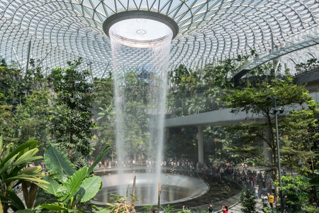 Changi Airport, Singapore - ââOctober 12, 2023: Changi airport waterfall landmark at Jewel building. Famous travel destination for passenger to visit near terminal1のeditorial素材