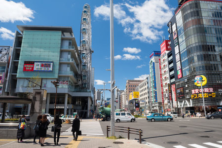 Nagoya, Japan  - April 11, 2019: people wait to cross Otsu-dori street to Sunshine Sakae shopping mall and Don Quijote. Famous travel, shop, and business landmark.のeditorial素材