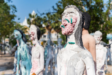 Closeup female ruined face demon or Thai ghost to demonstrate people punished for bad sin or behavior before death at Wat Phai Rong Wua, Suphanburi, Thailandの写真素材