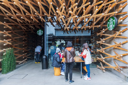 Fukuoka, Japan - Mar 30, 2024: Tourists people visit iconic Starbucks coffee store in Dazaifu,...
