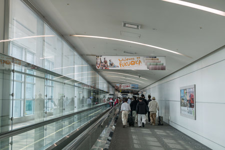 Fukuoka, Japan - Mar 30, 2024: Arrival people walk in Fukuoka airport terminal to meet immigration. Here is airport in island of Kyushu and the fourth busiest passenger airport of Japan.のeditorial素材