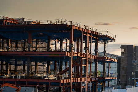 Construction architecture site at sunset in Shimuzu, Shizuoka, Japan. High rise building real estate construct in progress. Heavy industrry.の写真素材