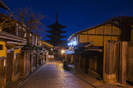 Silhouette Yasaka Pagoda of Hokanji temple with traditional Japanese house village along Sannenzaka street of Higashiyama Ward at night, Kyoto, Japan. Famous travel destination for tourist in Kansai on peak fall in December.の写真素材