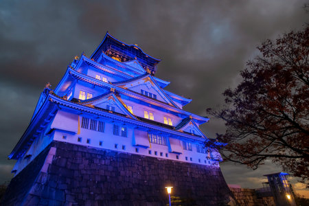 Osaka castle blue light up at night in autumn, Kansai, Japan. Famous travel destination for sightseeing Kansai in fall season.の写真素材