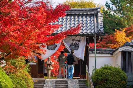 Japanese people enter at Kenninji temple gate with beautiful fall foliage leaves, Kyoto, Japan. Famous travel destination in Kansai especially in autumn season.の写真素材