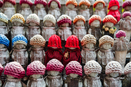 Jizu statues in colorful knit hats decor of Hase-dera or Hasedera Temple, Sakurai, Nara, Japan. travel destination for tourist in Kansai on peak fall in December.の写真素材
