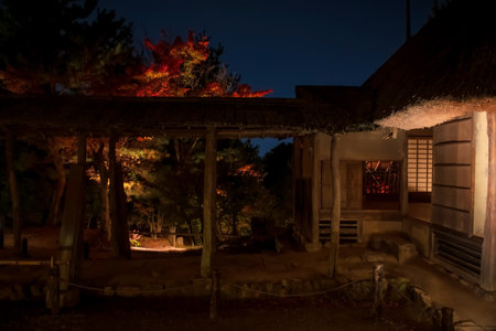 Autumn leaves and illumination by cabin of Kodaiji temple garden at night, Kyoto, Japan. Famous travel destination during fall season.の写真素材