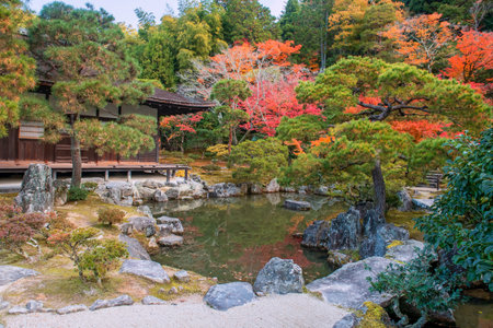 Beautiful architecture and autumn garden by pond of Silver Pavilion Ginkakuji temple in Kyoto,...