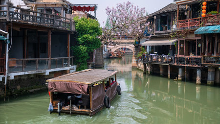 tourist motor boat sailing along Zhujiajiao water town, Qingpu District, Shanghai, China. Famous travel destination known as Chinese Venice.の写真素材