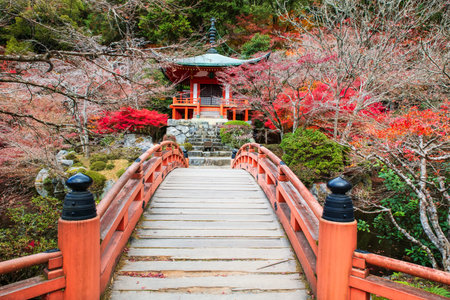 Red bridge to Pavilion pagoda in autumn at Daigo-ji temple, Kyoto, Japan. Famous travel destination...