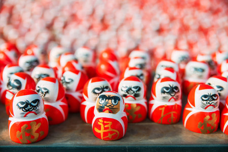 Many small daruma figure decor in Katsuo-ji temple against sunlight, Minoh, Osaka, Japan. Famous...