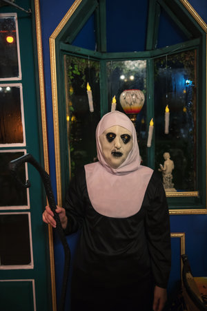 Fear female devilish nun with witch Cane for fancy 2025 night Halloween costume night party.の写真素材