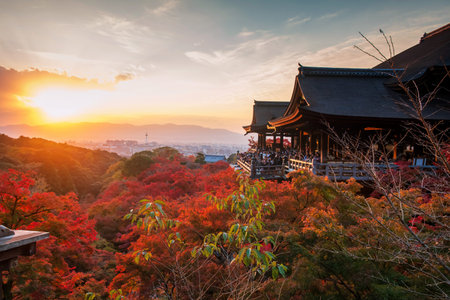 Kyoto, Japan - Dec 3, 2024: Tourism people at Kiyomizu-dera temple terrace to view colorful maple autumn leaf at sunset. Famous travel destination for tourist sightseeing Kansai in fall.の写真素材