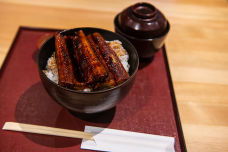 Eel teriyaki over rice or grill unagi don bowl with miso soup on table. Japanese food styleの写真素材