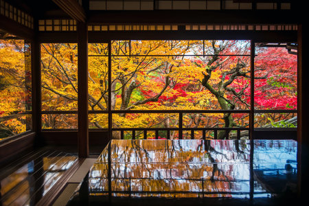 Wooden table with symmetry foliage reflection of autumn maple leaf garden in Ruriko-in Temple,...