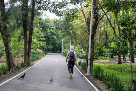 Fit man walking exercise in Wachira Benchathat or Rot Fai Park, Bangkok, Thailand. Healthy lifestyle.の写真素材