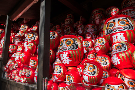 Daruma dolls in wooden cabinet decor at Katsuo-ji temple, Minoh, Osaka, Japan. travel destination for sightseeing Kansai in fall. Temple of victoryの写真素材