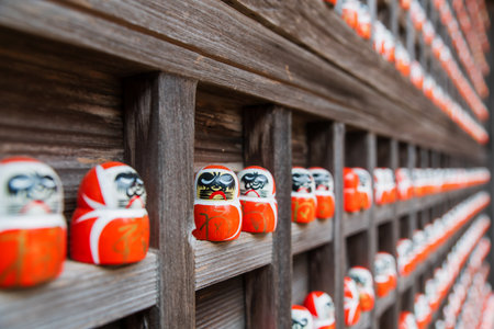 small daruma figurines decor on wooden wall in Katsuo-ji temple, Minoh, Osaka, Japan. Famous travel destination for sightseeing Kansai in fall. Temple of victoryの写真素材