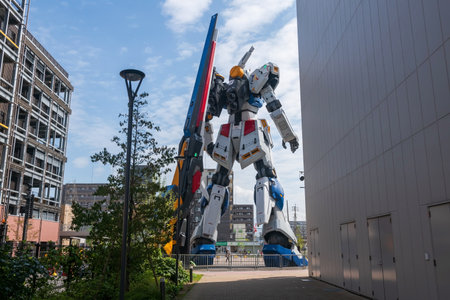 Fukuoka, Japan - April 7, 2024:Rear of life size RX 93ff Î½ Gundam robot figurine against blue sky at Mitsui Shopping Park LaLaport.のeditorial素材