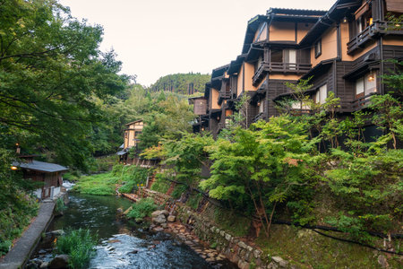 ryokan hotel buildings by river in Kurokawa onsen town, Kumamoto, Japan. Famous travel destination...