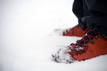 Hiking shoes on snowの写真素材
