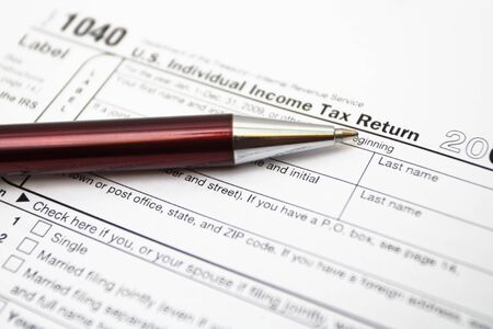 1040 tax return form and pen. Closeup on Tax Returnの写真素材