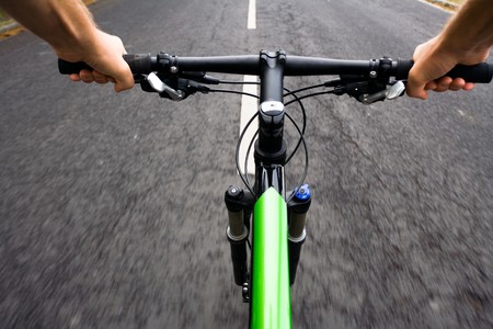 Bicycle rider riding real fast, motion blurの写真素材