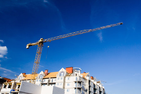 Construction site over summer blue sky, building growth