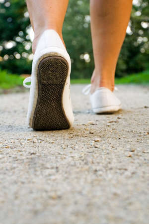 Woman exercise walking outdoors, shoes closeupの写真素材