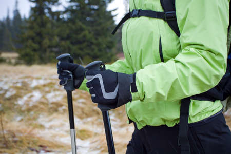 Woman on nordic walking trip in winter mountainsの写真素材