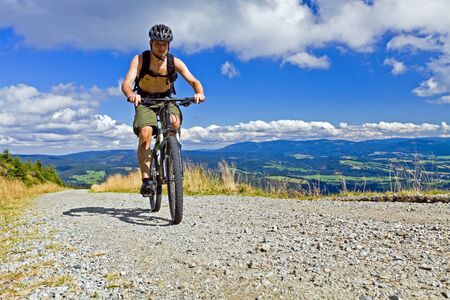 Mountain biking in summer mountainsの写真素材