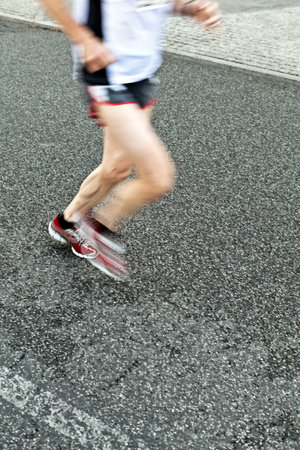 People running in marathon on city street, motion blurの写真素材