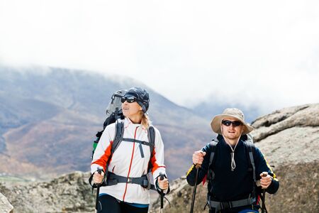 Couple hiking in himalayas mountains in Nepalの写真素材