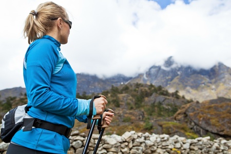 Young woman hiker hiking in Himalaya Mountains in Nepalの写真素材