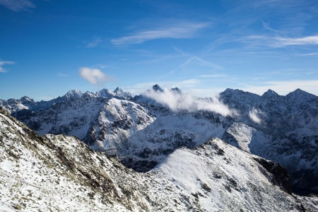 Mountains landscape in winter in Tatras. Mountain ridge over blue sunny sky, Polandの写真素材