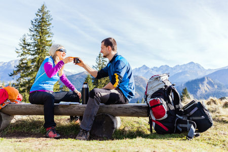 Man and woman, hikers camping in mountainsの写真素材