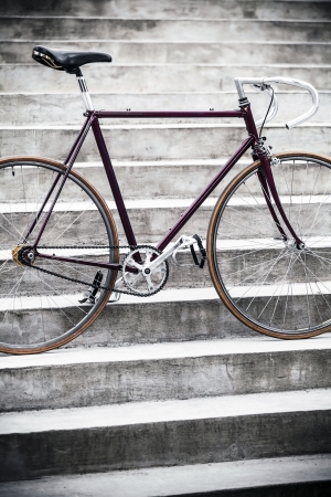 City bicycle fixed gear and concrete stairsの写真素材
