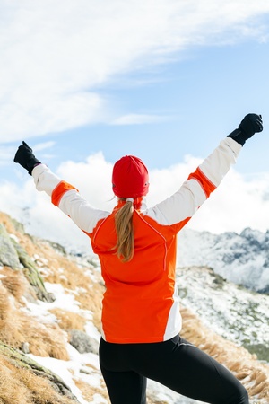 Hiking woman and success in mountains, arms outstretchedの写真素材