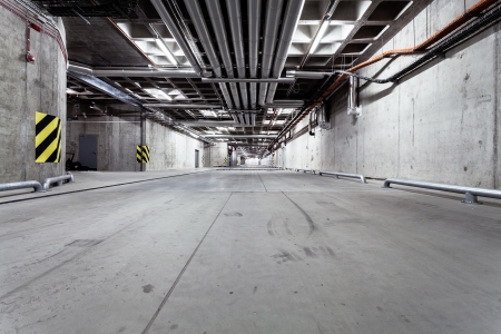 Parking garage underground interior, neon lights in dark industrial building, modern public constructionのeditorial素材