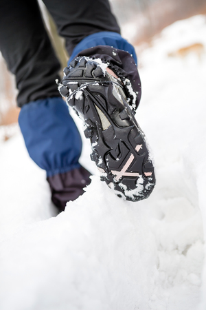 People hiking walking in white winter forest on deep snow. Recreation and healthy lifestyle outdoors in nature, motivational and healthy concept.の写真素材