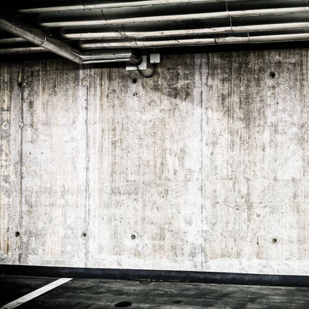 Concrete Wall Construction in Parking Garage Underground Interior background or texture. Concrete grunge wall, industrial retro vintage interior.の写真素材