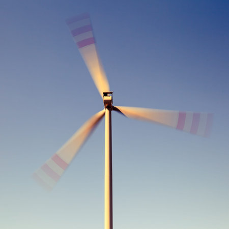 Wind turbine farm, alternative energy, electricity power generator rotating fast, blurred motion....