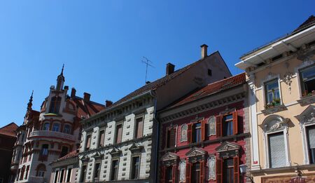 main square facades with paintings and stucco decorations - Maribor, Sloveniaの写真素材